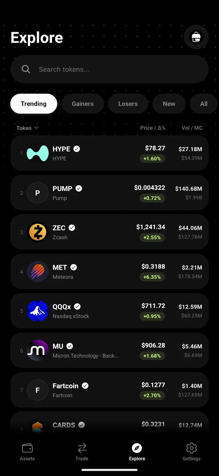 The Explore screen in ChatFi listing trending tokens and stocks with prices and volume